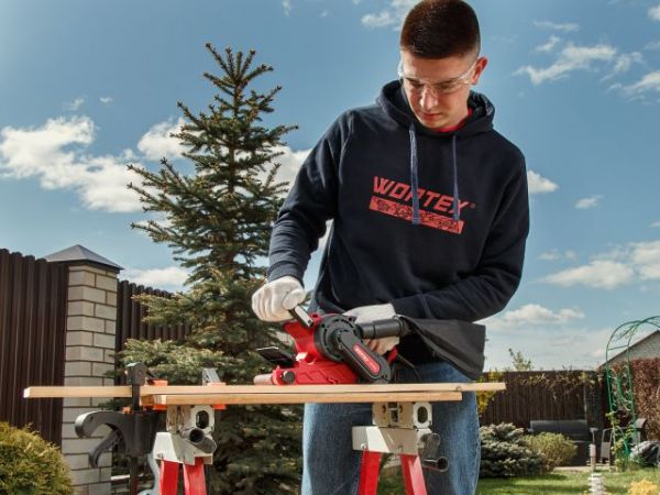 Ленточная шлифмашина Wortex SB 7611 E в кор. 1150 Вт, лента 76х533 мм, крепление к столу(120-380 м/мин, откидной носик)